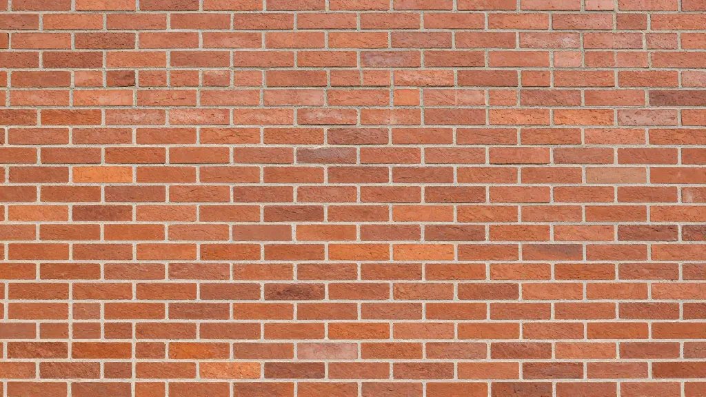 Distant shot of a pristine brick wall exterior with fresh mortar joints