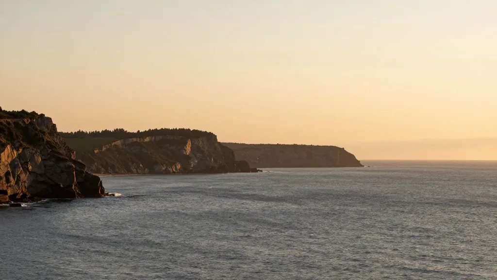 Distant view of a coastal cliff horizon at golden hour