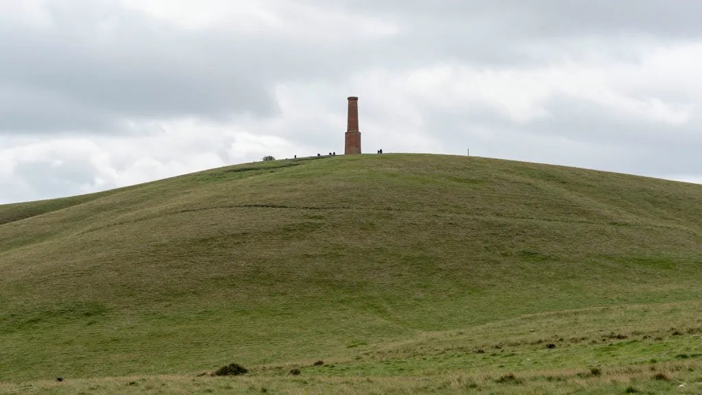Expansive hillside with a lone brick chimney skyline