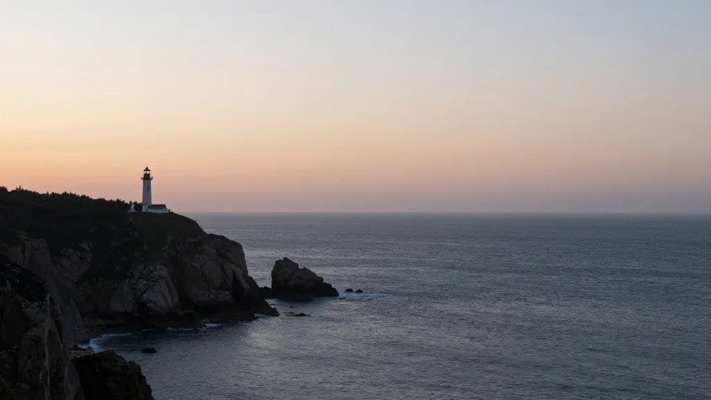 Distant coastal cliff overlooking sea at dawn, solitary lighthouse silhouette